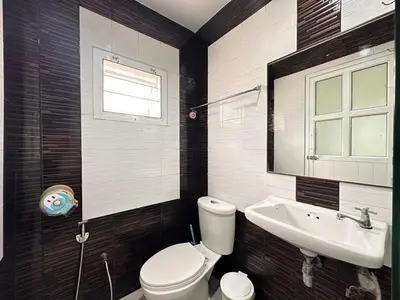 a bathroom with a toilet and a sink at cozy Best house with garden near Bang Tao beach in Ban Thalat Choeng Thale