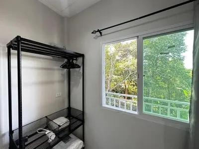 a bathroom with a shower and a window at VISUT apartments near mountain in Ban Thalat Choeng Thale
