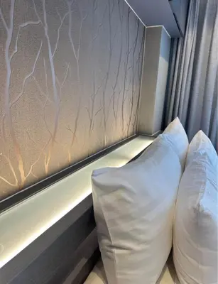 a pillow sitting next to a window on a train at Tropical bliss & serenity in CityGate Resort near Kamala Beach in Phuket Town