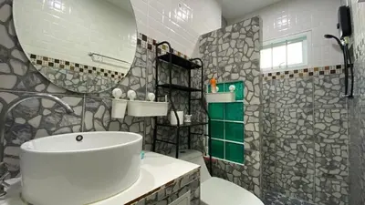 a bathroom with a white sink and a mirror at Cozy 2-bedrooms houses complex DIN, Bang Tao beach in Ban Thalat Choeng Thale
