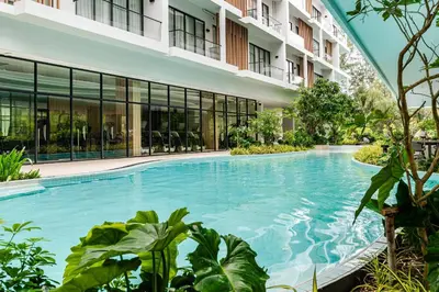a swimming pool in the middle of a building at Laya Resort -Tropical Studio in Layan Beach