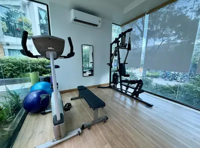 a gym with two exercise bikes and a exercise ball at Z cape 1 one one in Laguna Phuket