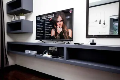 a counter in a room with a tv on a wall at Beautiful apartment in Ban Thalat Choeng Thale