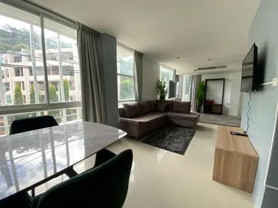 a living room with a couch and a table at Kris condo in Patong Beach