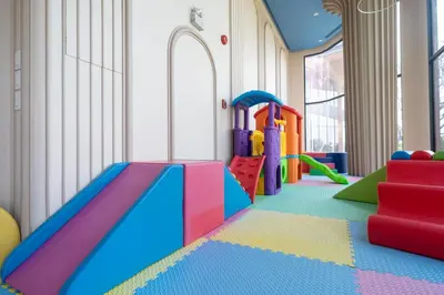 a play room with a slide and play equipment at Apartments Bellevue Lagoon Phuket near Laguna in Phuket