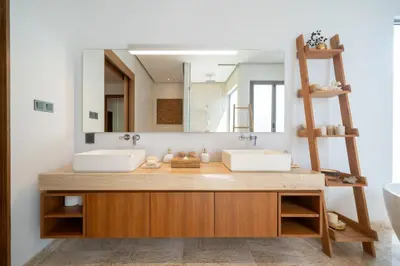 a bathroom with two sinks and a mirror at Anchan 4 bedroom near Beach in Phuket