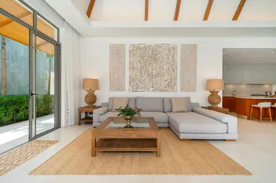 a living room with a couch and a table at Anchan 4 bedroom near Beach in Phuket