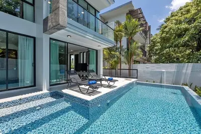 a swimming pool in the backyard of a house at 3BR Pool Villa with Jacuzzi near Patong - 8 Guests in Kathu