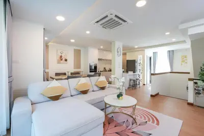 a living room with a couch and a table at 3BR Pool Villa with Jacuzzi near Patong - 8 Guests in Kathu