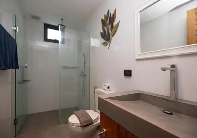 a bathroom with a toilet and a glass shower at Sleek Designed Sunset Garden Villa 05 - 4 BR with Salt Private Pool 12M in Ban Saiyuan (1)