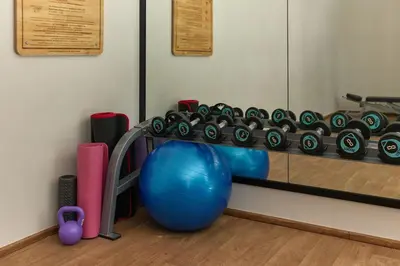 a gym with a fitness rack and a ball at Cozy Apartment at Rawai with Pool Access in Phuket Town