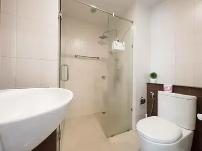 a bathroom with a shower and a toilet and a sink at Apartments in the NICE condominium on Bang Tao Beach in Ban Thalat Choeng Thale