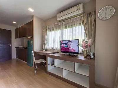 a room with a desk with a computer on it at Apartments in the NICE condominium on Bang Tao Beach in Ban Thalat Choeng Thale