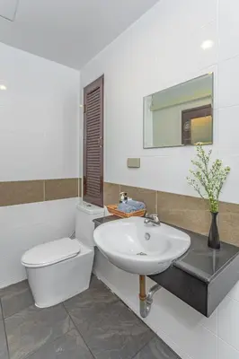 a bathroom with a white toilet and a sink at sunflower \u4e00\u5367\u7cbe\u54c1\u5927\u5e8a\u623f\u5e26\u9633\u53f0 in Patong Beach