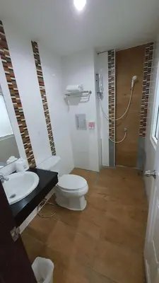 a bathroom with a toilet and a sink and a shower at fruit paradise hotel in Patong Beach