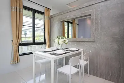 a dining room with a white table and chairs at House in a quiet and stylish location NU8, Bang Tao in Surin Beach