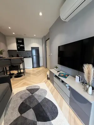a living room with a large flat screen tv at New and Stunning 1BR, The Title Legendary by UNO in Bang Tao Beach