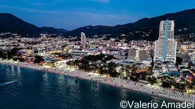 a view of a city with a beach at night at OMNIAPHUKET - Sea View Patong Tower - Top Location & Sea View in Patong Beach