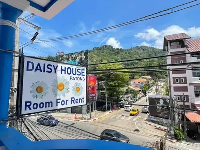 a room for rent sign on a city street at Daisy House Patong in Patong Beach