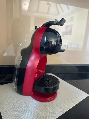 a red and black iron sitting on top of a counter at 3 bedroom Vip Villa Rawai Phuket in Rawai Beach