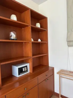 a microwave sitting on top of a wooden cabinet at 3 bedroom Vip Villa Rawai Phuket in Rawai Beach