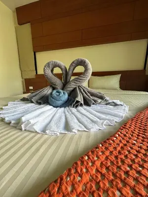 a bed with two swans made out of towels at 3 bedroom Vip Villa Rawai Phuket in Rawai Beach