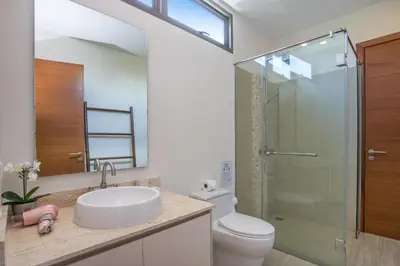 a bathroom with a toilet and a sink and a shower at Private Pool 4BR Villa Kari next to Rawai Beach in Rawai Beach