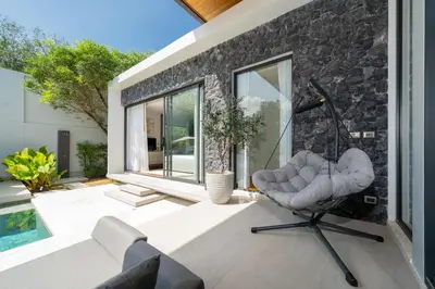 a living room with a couch and a chair at Villa Beautiful swimming pool in Phuket
