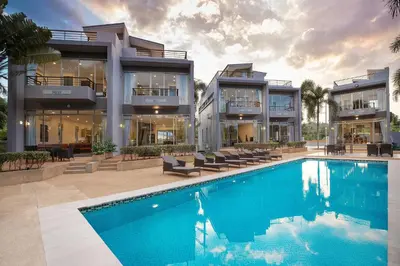 a large house with a swimming pool in front of it at 3BR Pool Access Villa near Mission Hills Golf - Argent 7 in Ban Muang Mai