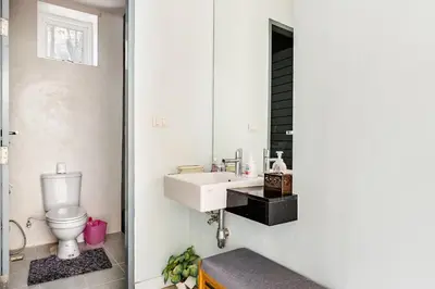 a bathroom with a sink and a toilet at Villa Beverly Private Infinity Pool with Seaview near Kata Beach in Kata Beach