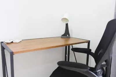a desk with a lamp and a chair at Sisters Ari 2-bedrooms house, Bang Tao beach in Ban Thalat Choeng Thale