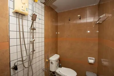 a bathroom with a shower and a toilet in it at SIRI apartments Bangtao beach in Ban Thalat Choeng Thale