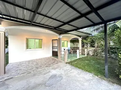 a pergola over a patio of a house at 2-bedroom's sweet house, Bang Tao beach in Ban Thalat Choeng Thale