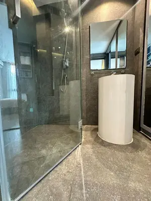 a shower with a glass door in a bathroom at CityGate Kamala 1 bedroom By Ere L309 in Kamala Beach