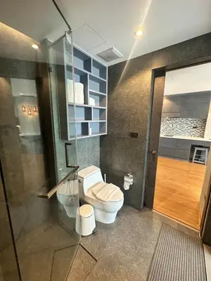 a bathroom with a toilet and a shower at CityGate Kamala 1 bedroom by Ere L807 in Kamala Beach
