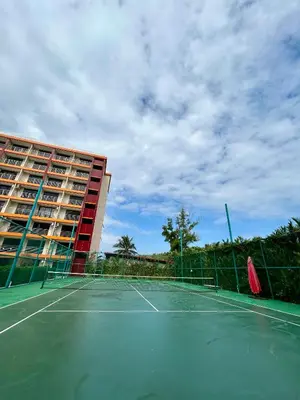 a tennis court in front of a hotel at Hillside-Seashore Space Mai Khao Beach in Mai Khao Beach