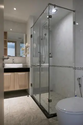 a bathroom with a shower and a toilet and a sink at Comfy 1-BR Grand Kata VIP condo, 5 min to Kata beach in Kata Beach