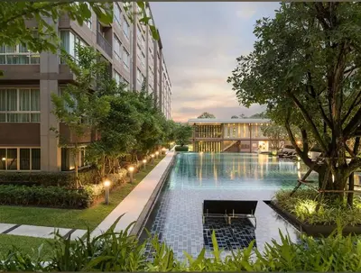 a large swimming pool in the middle of a building at Valley Mountain View&City Proximity Golden Eight Apartment in Ban Phlu Yai