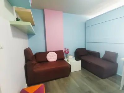 a living room with a couch and a chair at Valley Mountain View&City Proximity Golden Eight Apartment in Ban Phlu Yai
