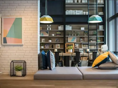 a living room with a couch and a dining room at Valley Mountain View&City Proximity Golden Eight Apartment in Ban Phlu Yai