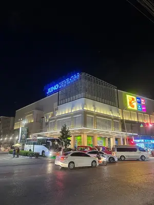 a building with cars parked in front of it at night at Grand Patong Apartment 7FL in Patong Beach