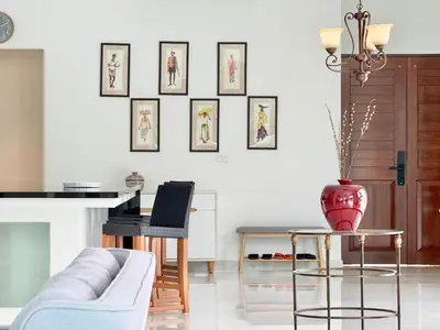 a living room with a couch and a table at Kamala Seaview - 3 BR Private Pool Villa in Kamala Beach