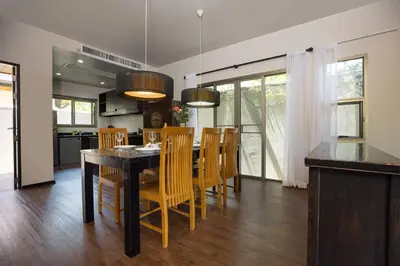 a kitchen and dining room with a table and chairs at Private 3BR Pool Villa Mylico 3min drive Nai Harn Beach in Rawai Beach