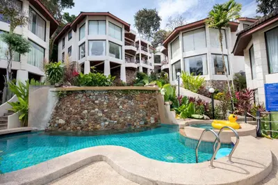 a swimming pool in front of a building at 3 BR Seaview Apt with pool access ADMC 100-2 in Ban Ao Makham