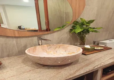 a bathroom with a large bowl sink on a counter at La La Lay Beach House in Tab Kaek Beach