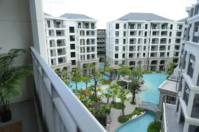 a view of a pool from the balcony of a hotel at Cozy 1 Bdr Title Legendary Bang Tao 5 min to the Beach in Bang Tao Beach