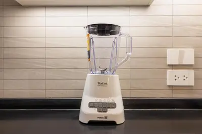 a white blender sitting on top of a counter at Oliva 1BR Suite — The Title Legendary BangTao in Bang Tao Beach