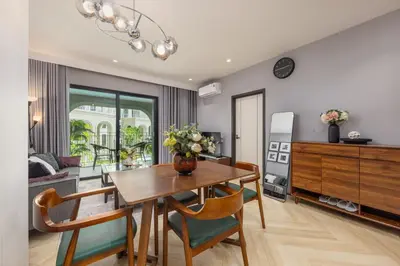 a kitchen and dining room with a table and chairs at Oliva 1BR Suite — The Title Legendary BangTao in Bang Tao Beach
