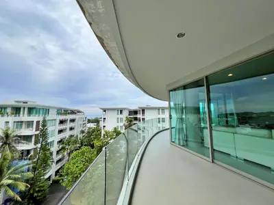 an empty balcony of a building with views of the ocean at The Ark Karon Beach by RESAVA in Karon Beach