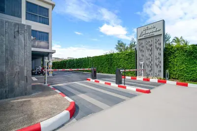 a building with a gate in front of a building at Laguna Lakeside by Villacarte in Bang Tao Beach
